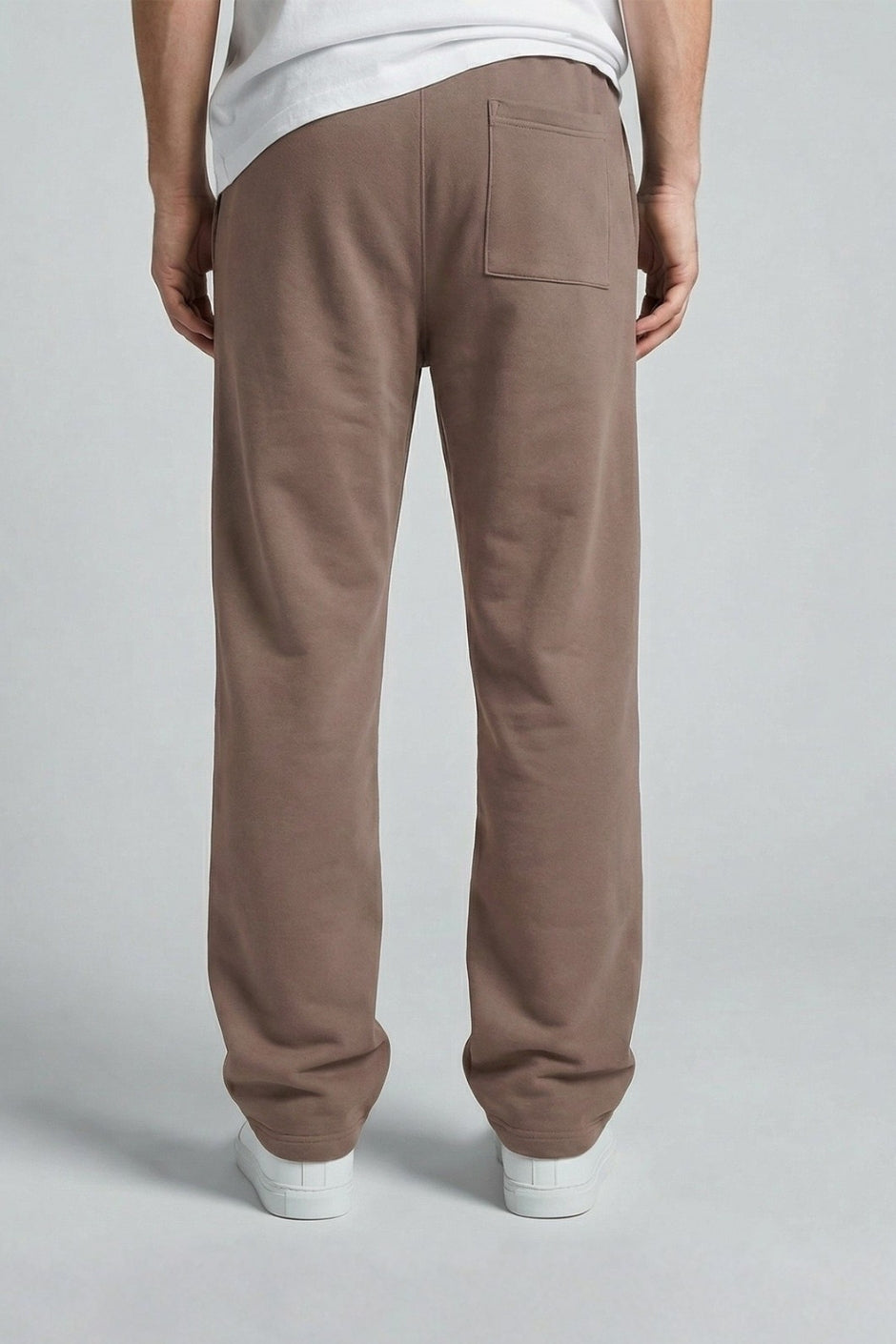 Chocolate jogger worn by a person on a plain background