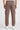 Chocolate cargo jogger worn by a person on a white background