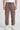 Chocolate cargo jogger worn by a person on a white background