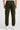 Person wearing olive cargo joggers on a white background