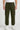 Person wearing olive cargo joggers on a white background