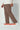 Chocolate jogger worn by a person on a white background
