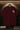 Maroon red t-shirt with 'FUTURE' text on a hanger against a dark background