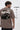 Man wearing a chocolate t-shirt with 'Let's Go Racing' graphic and text on a white background