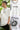Person wearing a white t-shirt with 'nothing.' text design, shown from front and back.