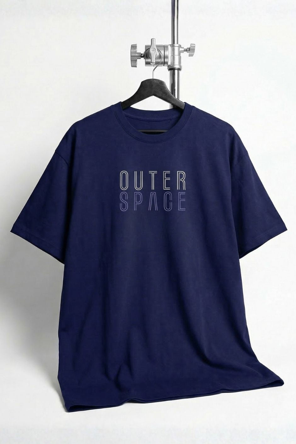 Royal blue t-shirt with 'OUTER SPACE' text on a hanger against a white background