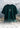 Bottle green t-shirt with a logo on a rocky surface with a mountainous background