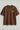 Brown t-shirt with text on a light gray background