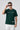 Man wearing a bottle green 'New York' t-shirt on a light gray background