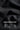 Close-up of black fabric with premium heavy gauge text and icons on a dark background
