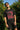 Person wearing a black t-shirt with red and white graphic design outdoors