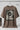 Chocolate t-shirt with 'OVER THINKING' graphic design on a hanger against a white background