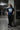 Man wearing a pastel blue t-shirt with 'SFCA' logo in a parking garage