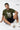 Man wearing a olive t-shirt with text and graphic, sitting on a white background