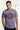 Man wearing a lilac t-shirt with a graphic design on a white background