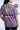 Person wearing a lilac t-shirt with a star and text design, branded 'The Perfect Retro Style'.